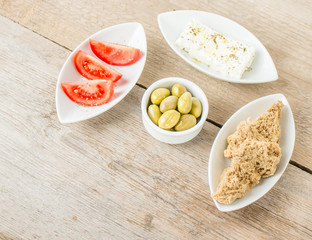 Greek Appetizers feta, tomatoes and rusks. Mediterranean traditional healthy food.