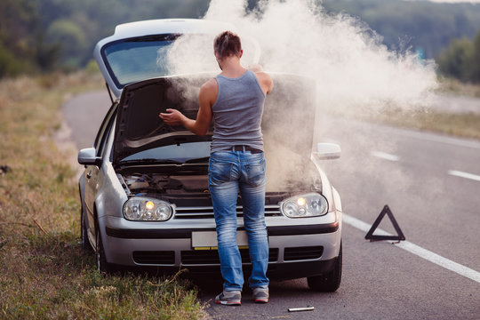 The Car Broke Down, Smokes From Under The Hood, The Driver.shocked