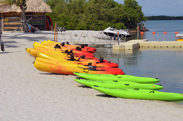 Kayaks resting on the sand on an island leased by a cruise ship line off the coast of Belize.