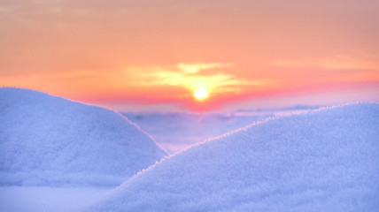 The harsh Northern winter landscape with sunset.
