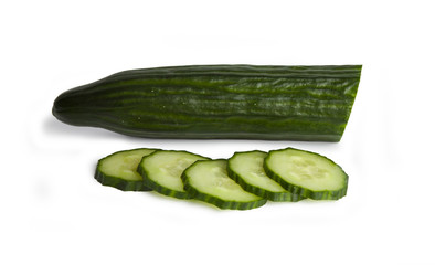 fresh cucumber and cucumber slices are isolated on a white background