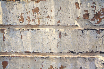 very old a battered and worn brick wall