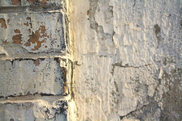 very old a battered and worn brick wall