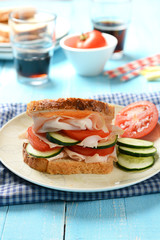 sandwich with roast turkey, cucumbers and tomato