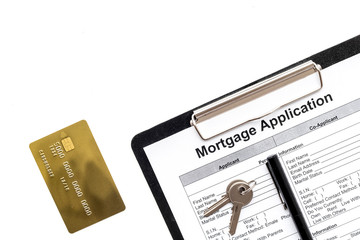 Mortgage application near bank card and apartment keys on white background top view copyspace