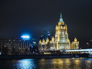 Fototapeta na wymiar night moscow signature architecture, lights, highway, traffic, streets, dark sky