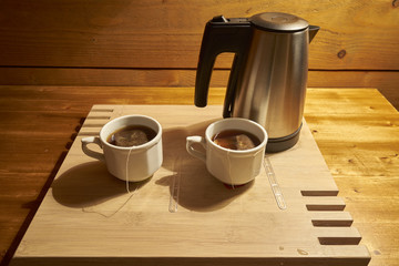 Two  Tea Cups and An Electric Kettle