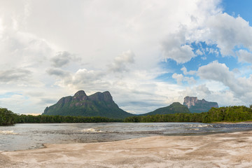 View of Ichu, Uripica and Autana mounts, from Ceguera camp in the Autana river, in Amazonas state,...