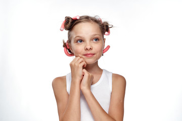 little girl in curlers