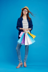 girl after shopping on a blue background