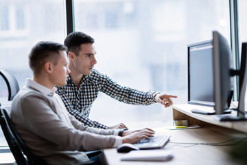 Picture of businesspeople working on computer together