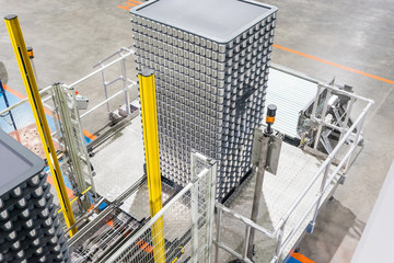 Canned food stacking on plastic pallet in Automated High/Low-level Depalletizer Machine