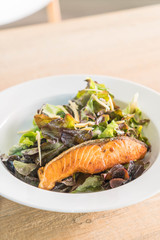 fried salmon steak with salad