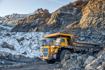 Big yellow dump truck and excavator in the coal mine, fisheye   © photollurg