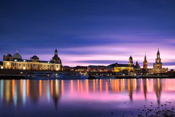 Fototapeta na wymiar Dresden cityscape panorama at purple Sunset. Fine art ‎long exposure picture of famous city in Europe with city lights and beautiful ‪‎water reflections in Elbe river. Perfect for wall or postcard