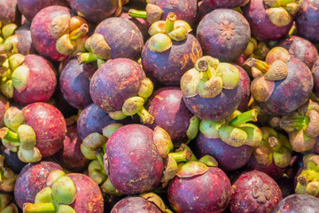 Mangosteen fruits on stand in supermarket