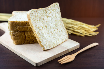 Sliced Whole wheat bread on Chopping Wood