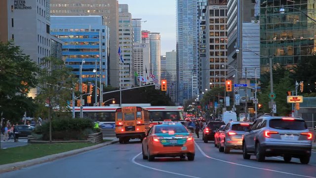 Busy street in the city of Toronto at dusk. Province of Ontario, Canada