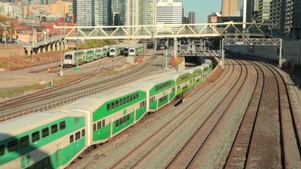Time lapse of green double decker trains passing by in the city of Toronto. Province of Ontario, Canada