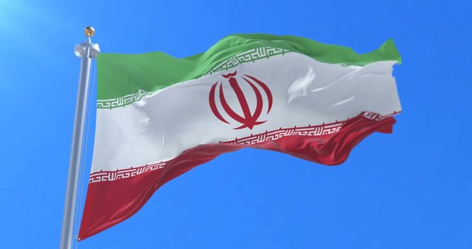 Flag of Iran waving at wind in slow in blue sky, loop