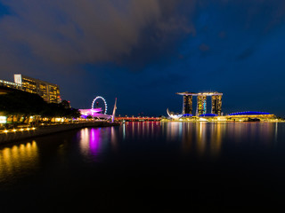 Fototapeta na wymiar Singapore skyline at night with urban buildings. November, 2017