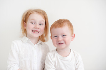Redheaded funny kids on a white background