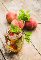 Glass of sweet peach iced tea