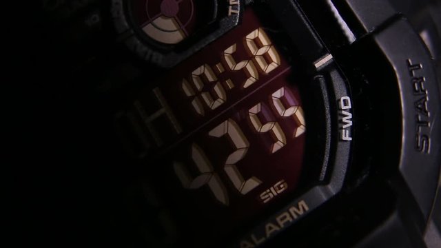 Macro close up of a tactical digital watch face functioning
