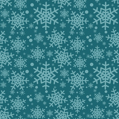 Winter vector pattern with small and big snowflakes.