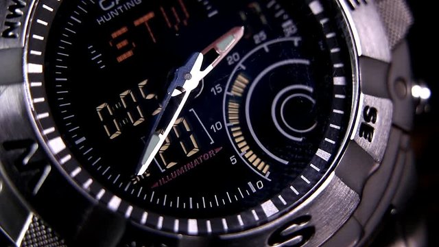 Macro close up of a tactical digital watch face functioning
