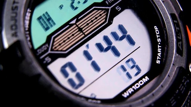 Macro close up of a tactical digital watch face functioning
