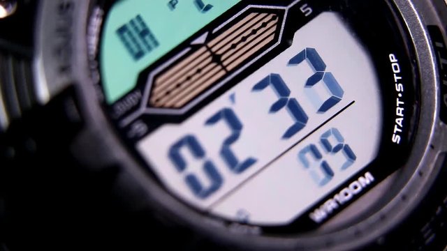Macro close up of a tactical digital watch face functioning

