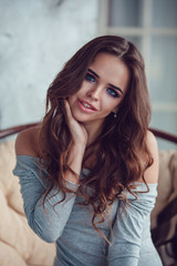 Obraz premium Portrait of a sexy woman with makeup and curls.