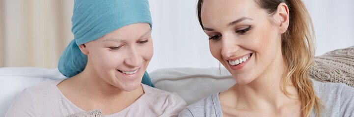 Friend and cancer girl laughing