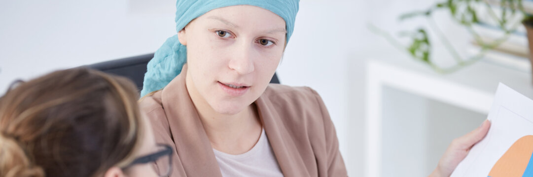 Cancer woman talking with assistant