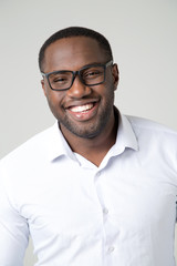 Portrait of afro american man with glasses. Smiling face of a young man.