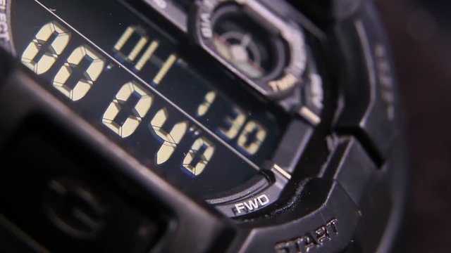 Macro close up of a tactical digital watch face functioning
