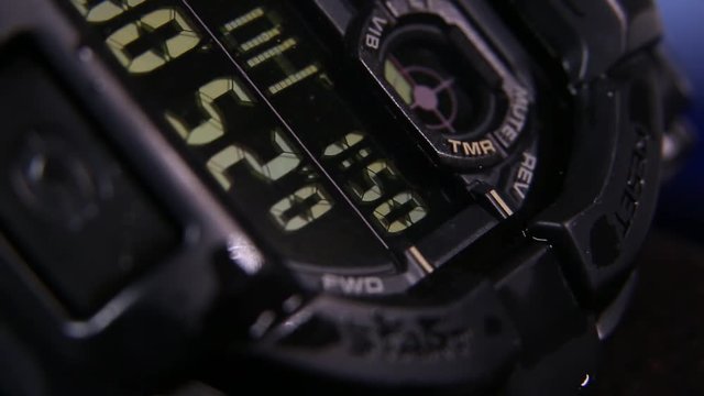 Macro close up of a tactical digital watch face functioning
