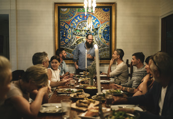 Group of diverse friends are having a dinner together