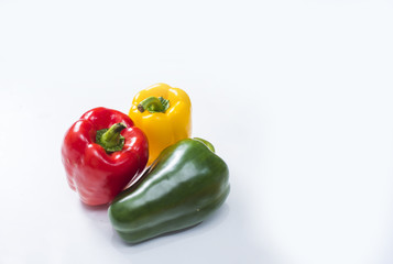 three bell peppers isolated on white background