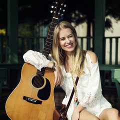 Beautiful singer songwriter with her guitar