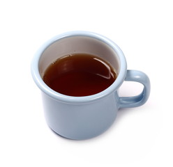 Black tea in blue metal cup isolated on white background