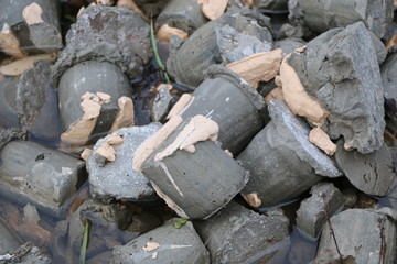 small concrete cylinders in water, in paint and in mounting foam