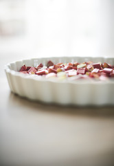 preparing a rhubarbpie in a platter