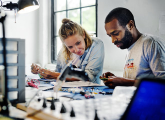Technicians working on electronics parts