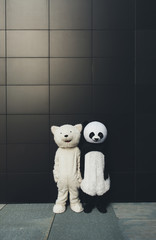 Panda and teddy bear having fun around the city