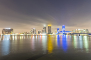 Fototapeta na wymiar JACKSONVILLE, FL - JANUARY 2016: City skyline at night. This is a famous attraction in Florida