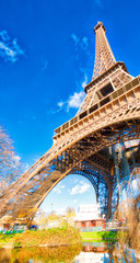 Fototapeta na wymiar Upward view of Eiffel Tower on a beautiful sunny winter day - Paris - France