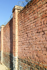 Fototapeta na wymiar Wall from a red brick