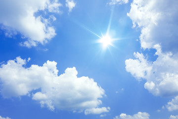 Naklejka na ściany i meble blue sky with sun and clouds background